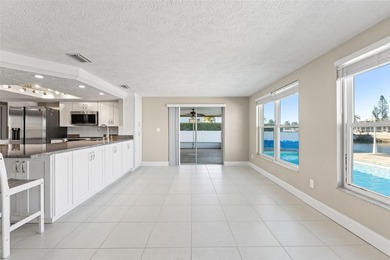 This beautifully updated Gulf Harbors waterfront home delivers on Gulf Harbors Golf Course in Florida - for sale on GolfHomes.com, golf home, golf lot