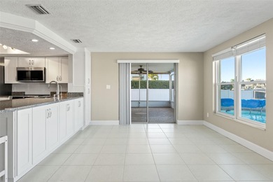 This beautifully updated Gulf Harbors waterfront home delivers on Gulf Harbors Golf Course in Florida - for sale on GolfHomes.com, golf home, golf lot