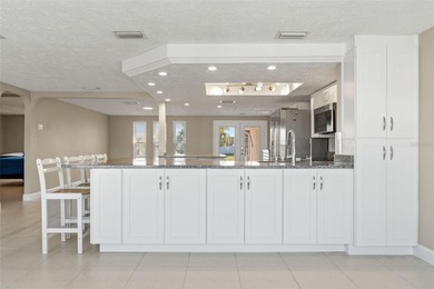 This beautifully updated Gulf Harbors waterfront home delivers on Gulf Harbors Golf Course in Florida - for sale on GolfHomes.com, golf home, golf lot