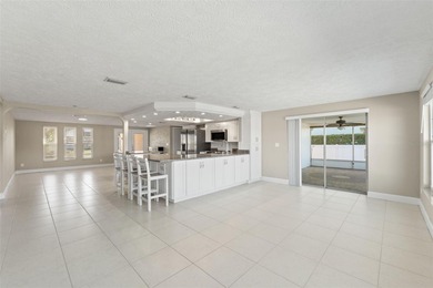 This beautifully updated Gulf Harbors waterfront home delivers on Gulf Harbors Golf Course in Florida - for sale on GolfHomes.com, golf home, golf lot