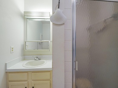 his turnkey 2 bedroom/2 bath condo has impact windows except for on The American Golf Club in Florida - for sale on GolfHomes.com, golf home, golf lot