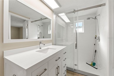 This beautifully updated Gulf Harbors waterfront home delivers on Gulf Harbors Golf Course in Florida - for sale on GolfHomes.com, golf home, golf lot