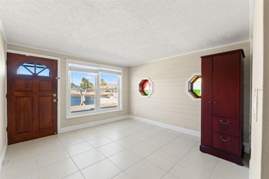 This beautifully updated Gulf Harbors waterfront home delivers on Gulf Harbors Golf Course in Florida - for sale on GolfHomes.com, golf home, golf lot