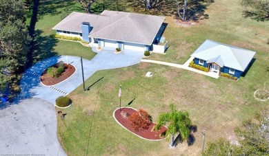 This beautifully remodeled home sits on a double lot with a on  in Florida - for sale on GolfHomes.com, golf home, golf lot