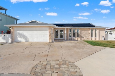 This beautifully updated Gulf Harbors waterfront home delivers on Gulf Harbors Golf Course in Florida - for sale on GolfHomes.com, golf home, golf lot