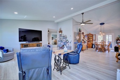 This beautifully remodeled home sits on a double lot with a on  in Florida - for sale on GolfHomes.com, golf home, golf lot