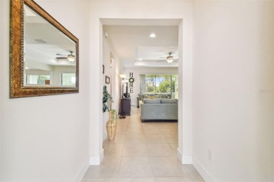 Absolutely stunning three-bedroom, two-bath, PLUS OFFICE on Apollo Beach Golf and Sea Club in Florida - for sale on GolfHomes.com, golf home, golf lot
