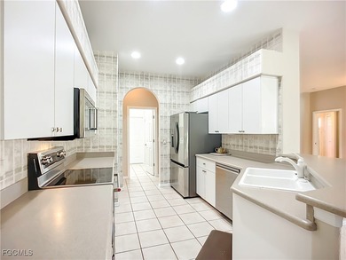 This professionally decorated home in HERONS GLEN COUNTRY CLUB on Herons Glen Golf and Country Club in Florida - for sale on GolfHomes.com, golf home, golf lot