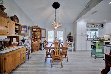 This beautifully remodeled home sits on a double lot with a on  in Florida - for sale on GolfHomes.com, golf home, golf lot