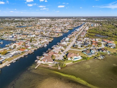 This beautifully updated Gulf Harbors waterfront home delivers on Gulf Harbors Golf Course in Florida - for sale on GolfHomes.com, golf home, golf lot