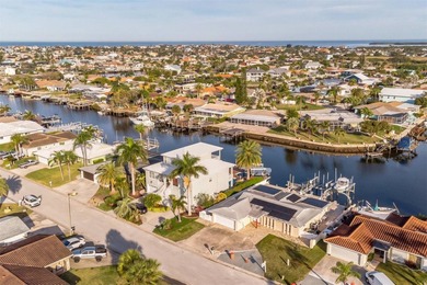 This beautifully updated Gulf Harbors waterfront home delivers on Gulf Harbors Golf Course in Florida - for sale on GolfHomes.com, golf home, golf lot
