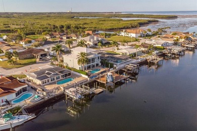 This beautifully updated Gulf Harbors waterfront home delivers on Gulf Harbors Golf Course in Florida - for sale on GolfHomes.com, golf home, golf lot
