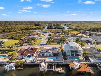 This beautifully updated Gulf Harbors waterfront home delivers on Gulf Harbors Golf Course in Florida - for sale on GolfHomes.com, golf home, golf lot
