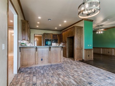 Beautiful golf course lot that backs to hole 15 on the west side on Oak Tree National Golf and Country Club in Oklahoma - for sale on GolfHomes.com, golf home, golf lot