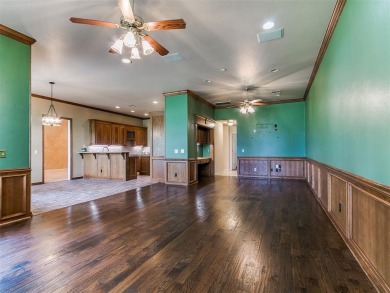 Beautiful golf course lot that backs to hole 15 on the west side on Oak Tree National Golf and Country Club in Oklahoma - for sale on GolfHomes.com, golf home, golf lot