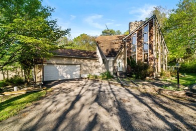 Experience the true Pocono feel in this warm and inviting on Pocono Farms Country Club in Pennsylvania - for sale on GolfHomes.com, golf home, golf lot