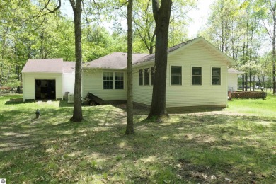 Welcome to this cozy 3-bedroom 2-bath home in Canadian Lakes on Canadian Lakes Country Club-The Royal Course in Michigan - for sale on GolfHomes.com, golf home, golf lot