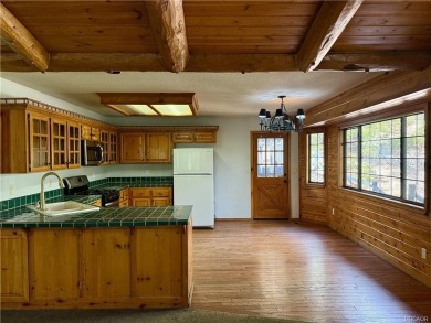 A true mountain escape in a premier Moonridge location--just a on Big Bear Mountain Ski and Golf Resort in California - for sale on GolfHomes.com, golf home, golf lot
