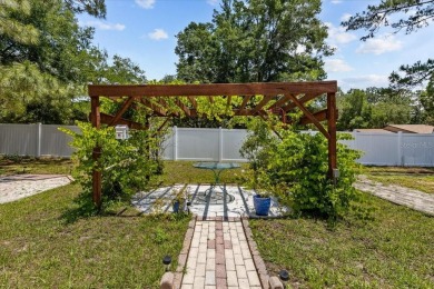 One or more photo(s) has been virtually staged. Gracious living on Rainbows End Golf Club in Florida - for sale on GolfHomes.com, golf home, golf lot