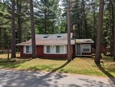 A cute two bedroom cottage sitting on a wide lot with sandy on Huron Breeze Golf Club in Michigan - for sale on GolfHomes.com, golf home, golf lot