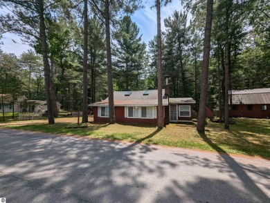 A cute two bedroom cottage sitting on a wide lot with sandy on Huron Breeze Golf Club in Michigan - for sale on GolfHomes.com, golf home, golf lot