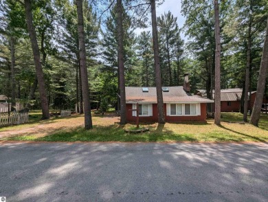 A cute two bedroom cottage sitting on a wide lot with sandy on Huron Breeze Golf Club in Michigan - for sale on GolfHomes.com, golf home, golf lot