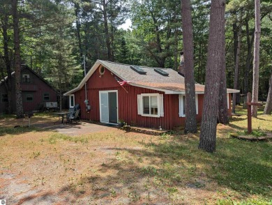 A cute two bedroom cottage sitting on a wide lot with sandy on Huron Breeze Golf Club in Michigan - for sale on GolfHomes.com, golf home, golf lot