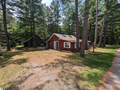 A cute two bedroom cottage sitting on a wide lot with sandy on Huron Breeze Golf Club in Michigan - for sale on GolfHomes.com, golf home, golf lot