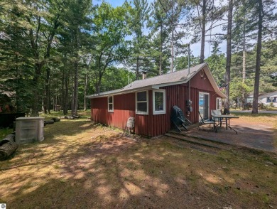 A cute two bedroom cottage sitting on a wide lot with sandy on Huron Breeze Golf Club in Michigan - for sale on GolfHomes.com, golf home, golf lot