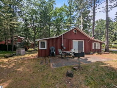 A cute two bedroom cottage sitting on a wide lot with sandy on Huron Breeze Golf Club in Michigan - for sale on GolfHomes.com, golf home, golf lot