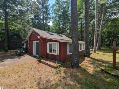 A cute two bedroom cottage sitting on a wide lot with sandy on Huron Breeze Golf Club in Michigan - for sale on GolfHomes.com, golf home, golf lot