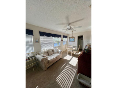 Experience the tranquility of waterfront living in this charming on Gulf Harbors Golf Course in Florida - for sale on GolfHomes.com, golf home, golf lot