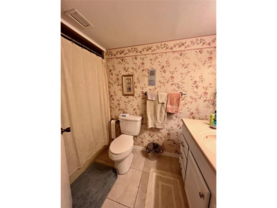 Experience the tranquility of waterfront living in this charming on Gulf Harbors Golf Course in Florida - for sale on GolfHomes.com, golf home, golf lot