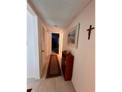 Experience the tranquility of waterfront living in this charming on Gulf Harbors Golf Course in Florida - for sale on GolfHomes.com, golf home, golf lot