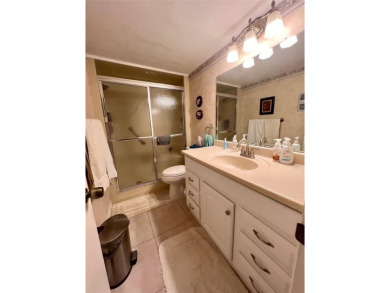 Experience the tranquility of waterfront living in this charming on Gulf Harbors Golf Course in Florida - for sale on GolfHomes.com, golf home, golf lot