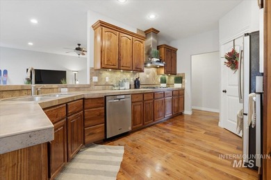 Welcome home to this beautiful 4-bedroom, 2.5-bath, two-story on Hunters Point Golf Club in Idaho - for sale on GolfHomes.com, golf home, golf lot