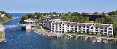 Waterfront condominium located in the heart of downtown on Charlevoix Golf Club in Michigan - for sale on GolfHomes.com, golf home, golf lot