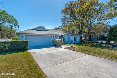 Welcome to this beautifully designed 3-bedroom, 2-bathroom home on Riviera Country Club in Florida - for sale on GolfHomes.com, golf home, golf lot