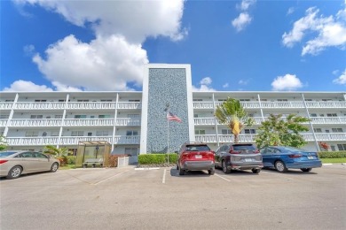 Enjoy South Florida living with this 2Bed/2Bath second floor on Hillsboro Pines Golf in Florida - for sale on GolfHomes.com, golf home, golf lot