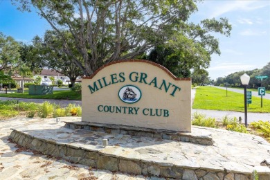 Enjoy peaceful views of the 14th fairway at Miles Grant Golf on Miles Grant Country Club in Florida - for sale on GolfHomes.com, golf home, golf lot