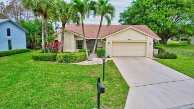 Magnificent lake view 2 bedroom, 2 bathroom, 2 car garage home on Boca Delray Golf and Country Club in Florida - for sale on GolfHomes.com, golf home, golf lot