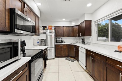 Welcome home, to your spacious 4-bedroom, 2-bath pool home in on Sunrise Country Club in Florida - for sale on GolfHomes.com, golf home, golf lot