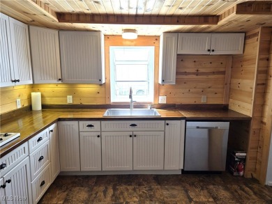 Welcome to this quaint, cape cod--nestled in a private Lake on The Harbor Golf Club in Ohio - for sale on GolfHomes.com, golf home, golf lot