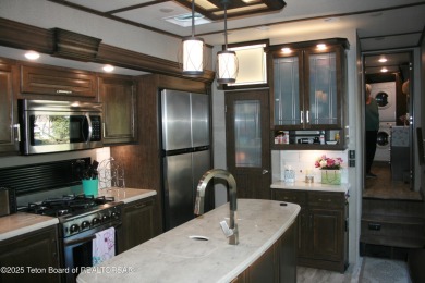 Extra large corner lot, with mature trees.  2021 36 foot Grand on Star Valley RV Golf Course in Wyoming - for sale on GolfHomes.com, golf home, golf lot