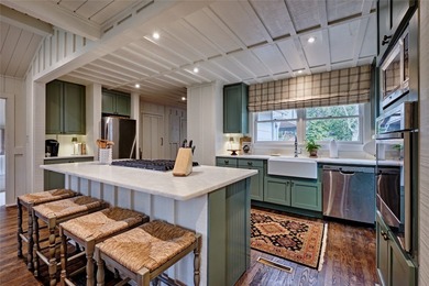 Nestled in the heart of High Hampton, this charming one-level on High Hampton Inn and Country Club in North Carolina - for sale on GolfHomes.com, golf home, golf lot