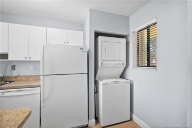 Situated in Port Salerno and in close proximity to downtown on Miles Grant Country Club in Florida - for sale on GolfHomes.com, golf home, golf lot