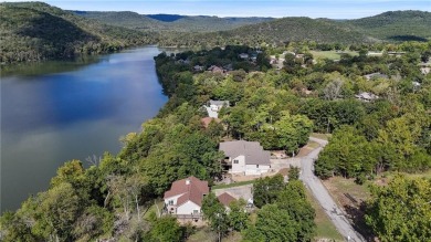 Lakefront living awaits! This .6-acre homesite offers the on Holiday Island Executive Golf Course in Arkansas - for sale on GolfHomes.com, golf home, golf lot