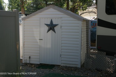 Extra large corner lot, with mature trees.  2021 36 foot Grand on Star Valley RV Golf Course in Wyoming - for sale on GolfHomes.com, golf home, golf lot