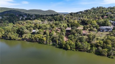 Lakefront living awaits! This .6-acre homesite offers the on Holiday Island Executive Golf Course in Arkansas - for sale on GolfHomes.com, golf home, golf lot