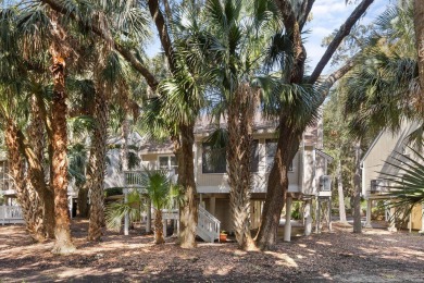 Nestled beneath the island's moss-draped live oaks and palms on The Seabrook Island Club in South Carolina - for sale on GolfHomes.com, golf home, golf lot